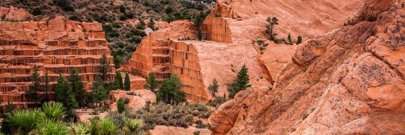red rocks that have long horizontal steps like a ziggurat that are left over from quarry operations 