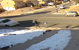 Video surveillance footage portraying: The suspect is described as White or Hispanic, average height and build, with reddish-brown hair in a ponytail, wearing a black sweatshirt, Camouflage-style pants, and “flip-flop” or “slides” shoes.