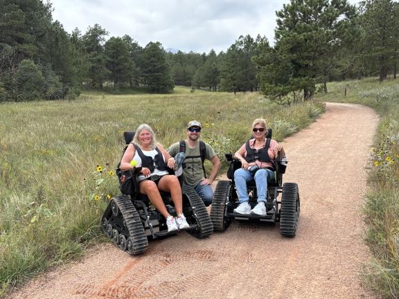 Two track chair users in Ute Valley Park.