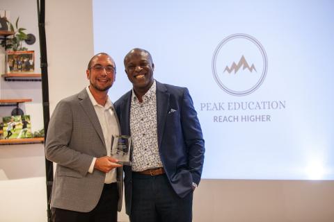 Carlos Jimenez (left) with his Spirit of the Springs award and Mayor Yemi (right)