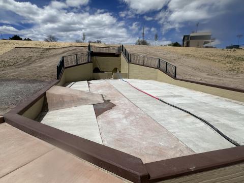 Pictured is the completed larger reservoir, within the Sand Creek Pond. It serves to slow the flow of runoff and allow sediment to settle within the structure before continuing down a narrow channel into a smaller pool.