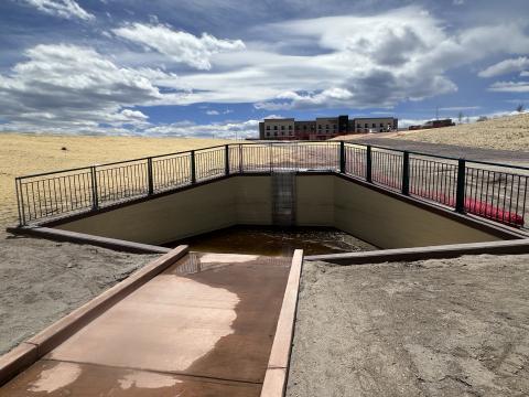 Sediment from both reservoirs will settle into the pictured completed smaller pool. The filtered water will continue its journey down the narrow channel. The City will clean out the sediment in the pool annually.