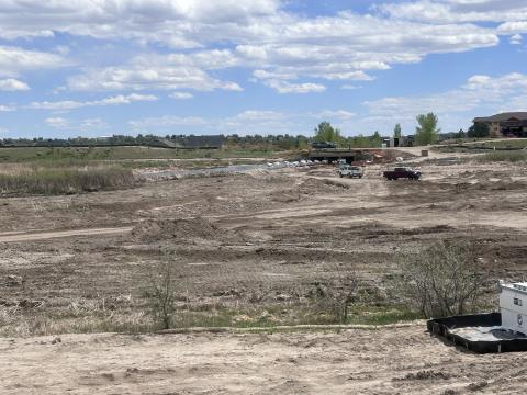 Pictured are&nbsp;crews working on the&nbsp;Sand Creek Flood Control Pond&nbsp;as they&nbsp;finish constructing the water outlet for the project.