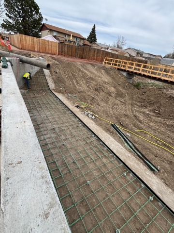 Work on the east side of the Hopeful Drive bridge near the temporary pedestrian crossing.