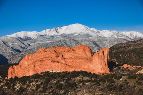 A photo of Garden of the Gods and Pikes peak in the background
