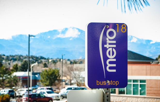 mountain metro bus stop sign and Pikes Peak