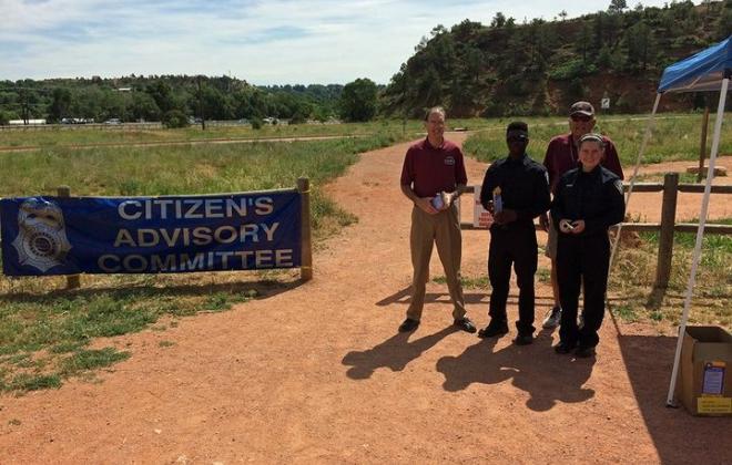 CSPD Citizen Advisory Committee members provide information at a local park