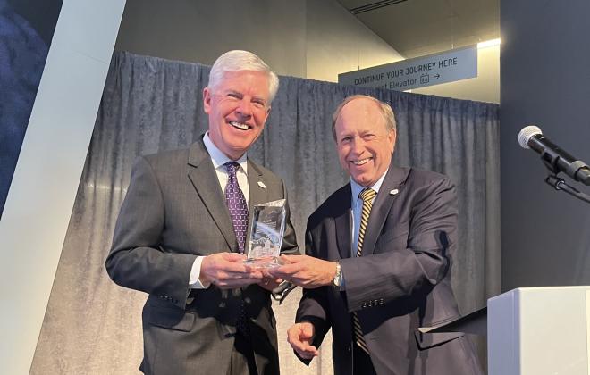 Mayor Suthers presents a Spirit of the Springs award to Doug Price, Visit Colorado Springs president and CEO