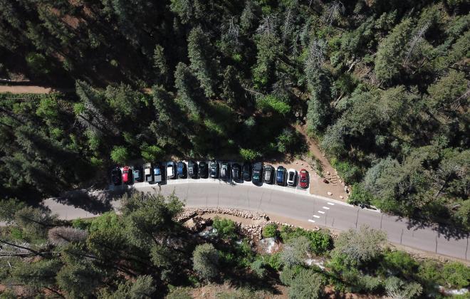 aerial view of cars parked in the new Mt. Cutler trailhead parking lot