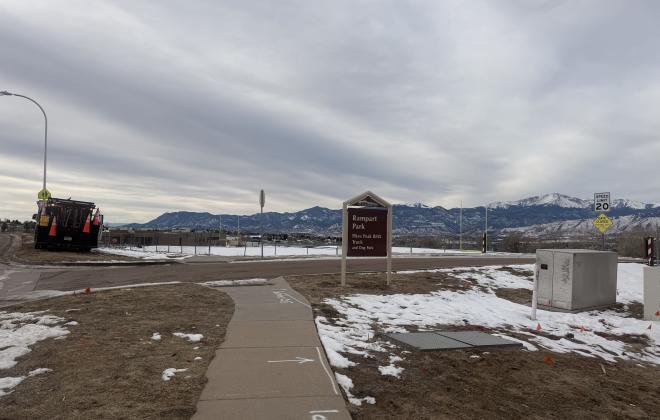 Rampart Park on a gloomy afternoon. There are trace amounts of snow on the ground.