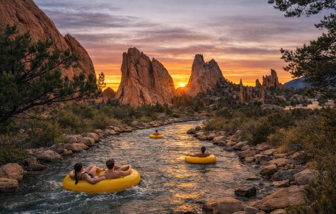 An AI-generated image of residents floating down a lazy river in inner tubers in Garden of the Gods.