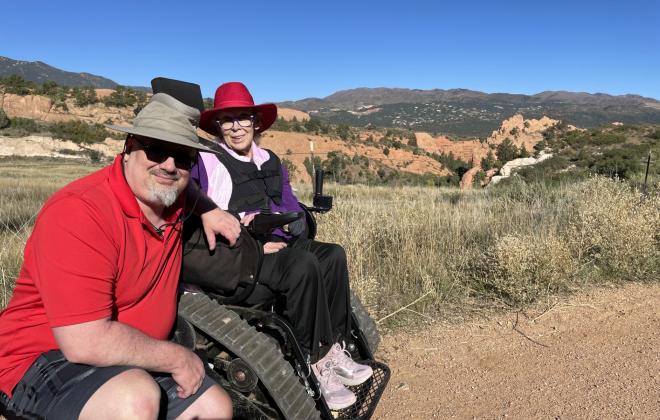 trackchair user on a city park trail