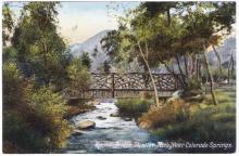 A postcard of the Stratton Park Bridge, reads "Rustic Bridge, Stratton Park, near Colorado Springs"