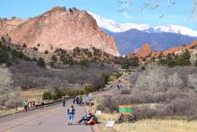 bikes, walker, skateboarders and other non-motorized users fill the road through Garden of the Gods Park