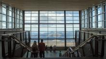 view from inside the summit visitor center through a wall of floor to ceiling windows
