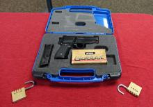 hand gun and ammo in a TSA approved carry case
